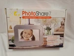 New 7 Digital Photo Frame With Remote. Fixed Price $19.95.