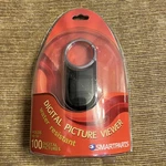 Smartparts Digital Picture Viewer 1" Holds 100 Photos Key Ring With Cable SP11P. Fixed Price $9.47.