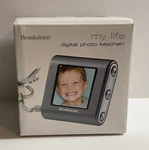 Brookstone My Life Digital Photo Keychain Holds 60+ Pictures Rechargeable Boxed. Fixed Price $21.99.