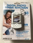 Spectra Digital Photo Frame Keychain, Holds 50+ PIX/2MB Flash MEM./1.5" Display. Fixed Price $12.45.