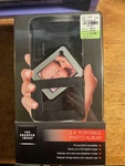 The Sharper Image 2.4" Portable Photo Album New Check It. Fixed Price $12.95.