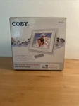 Coby 5.6 Digital Photo Frame With Built-in MP3 Player And Stereo Speakers. Fixed Price $12.00.