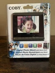 Coby DP356BLK Digital Photo Frame With Alarm Clock Black. Fixed Price $19.99.