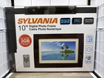 New Open Box Sylvania SDPF1089 10" Led Wood Finished Digital Photo Frame 2GB. Fixed Price $33.80.