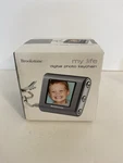 Brookstone Picture Book Mini Digital Photo Keychain With 1.5 Screen. Fixed Price $15.99.