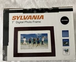 New! Sylvania 7" Digital Wood Brown Photo Frame For Desk Wall SDPF785 Picture. Fixed Price $14.00.