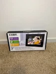 Coby DP700BLK 7-INCH Black Digital Picture Frame. Fixed Price $22.95.