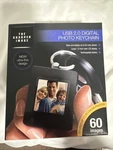 The Sharper Usb 2.0 Digital Photo Keychain, 60 Images, Rechargeable, New. Fixed Price $7.00.