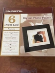 New Black Pandigital 6" Picture Frame With Remote, 128 Mb Int. Memory. Fixed Price $19.99.