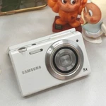 Samsung MV800 16.1MP Digital Camera 3.0" Flip-out Touchscreen 5X Zoom White Vlog. Fixed Price $279.63.