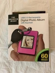 Sharper Image 1.4''DIGITAL Photo Album. Fixed Price $8.69.