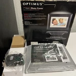 Optimus 7 Inch Digital Photo Frame Clean And Works Model 16-664 W/ Power Supply. Fixed Price $24.00.