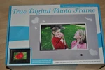 New True Digital 7" Photo Frame. Just Insert Your Memory Card! Remote Included!. Fixed Price $16.99.