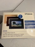 Polaroid 7" Digital Photo Kit Bonus Includes 3 Designer Frames XSA-00750B. Fixed Price $20.00.