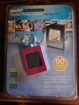 Shift Rechargeable 1.4" Digital Picture Frame With Key Chain. Fixed Price $15.00.