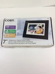 Coby Widescreen Digital Photo Frame Dark Brown DP732. Fixed Price $5.75.