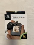 The Sharper Image 1.4 Digital Photo Album With Keychain Usb 2.0 Recharge. New. Fixed Price $13.00.