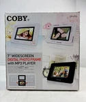 Coby 7 Inch Widescreen Digital Photo Frame With MP3 Player. Fixed Price $24.99.