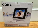 Coby Model DP-562 5.6" Digital Photo Frame MP3 Player White Black Music & Video. Fixed Price $30.00.