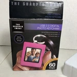 The Sharper Image Usb 2.0 Digital Photo Key Chain Purple New Box. Fixed Price $10.00.