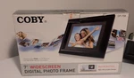 Coby 7" Widescreen Digital Photo Frame DP-758 (never Used). Fixed Price $9.86.