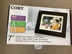 Coby Widescreen Digital Photo Frame Dark Brown DP732. Fixed Price $16.00.