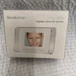 Brookstone My Life Digital Picture Show Photo Frame With 3" Screen. Fixed Price $18.00.