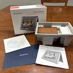 Brookstone Picture Book Portable Digital Photo Album. Fixed Price $15.00.