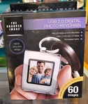 The Sharper Image Digital Photo Album W/ Keychain Usb 2.0 Rechargeable. Fixed Price $7.99.