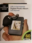 The Sharper Image Digital Photo Album With Keychain Usb 2.0 Rechargeable. Fixed Price $20.99.