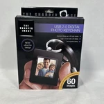 The Sharper Image Digital Photo Album With Keychain Usb 2.0 Rechargeable New. Fixed Price $7.79.