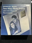 New Sharper Image Silver Frame 4 X 6 Two-way Lcd Clock & Thermometer. Fixed Price $16.00.