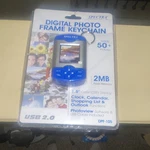 Spectra Digital Photo Frame Keychain, Holds 50+ PIX/2MB Flash MEM./1.5" Display. Fixed Price $23.00.